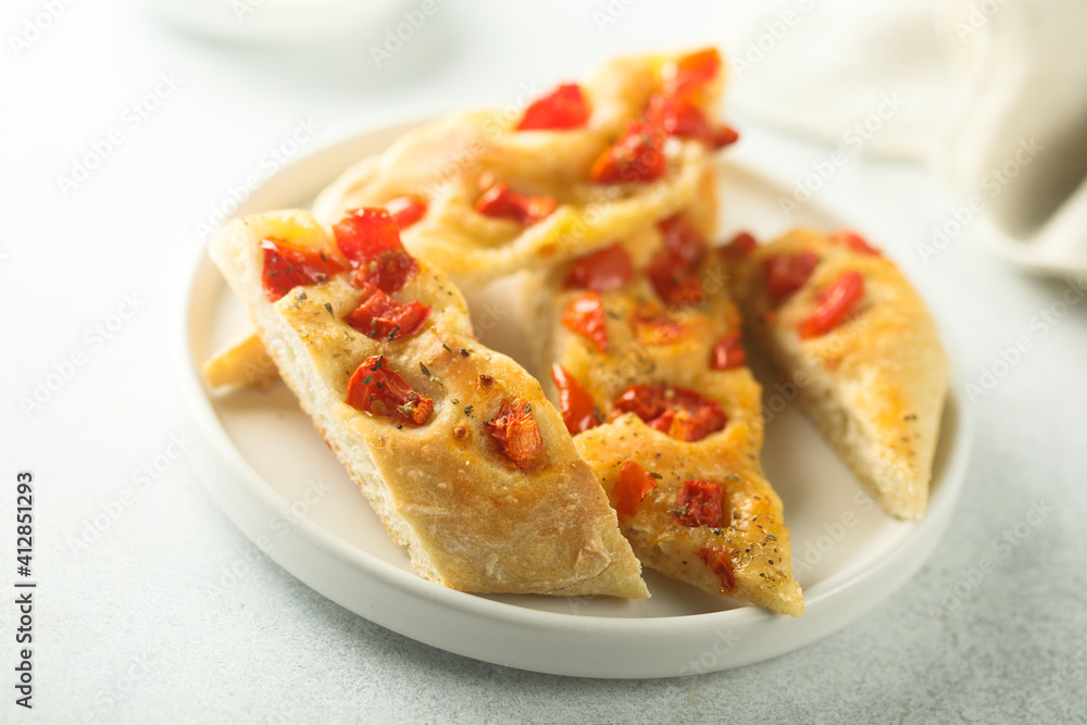 Delicious homemade focaccia bread with tomatoes Delicious homemade focaccia bread with tomatoes