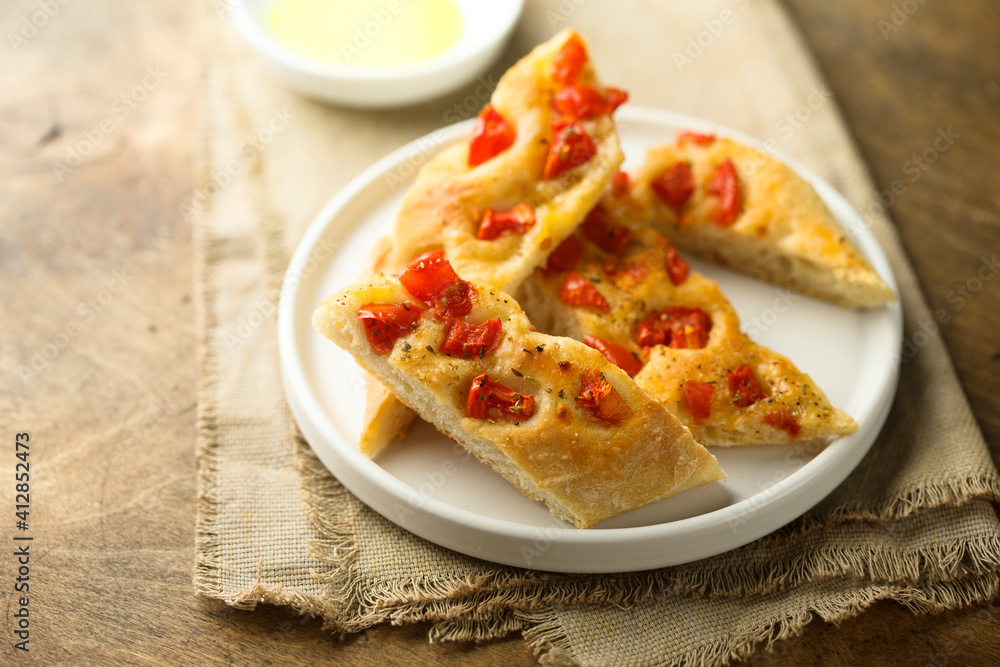 Delicious homemade focaccia bread with tomatoes Delicious homemade focaccia bread with tomatoes