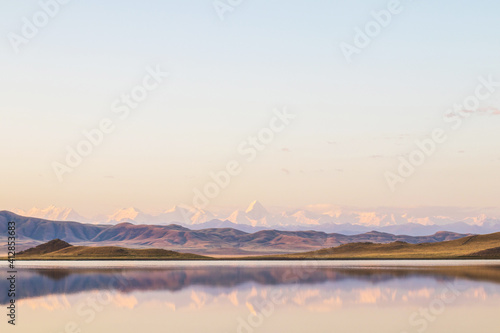 Lake Tuzkol in Kazakhstan and a view of Khan Tengri peak at sunrise
