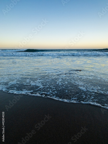 Gran Tarajal  Spain - Beautiful black sand beach at sunset.