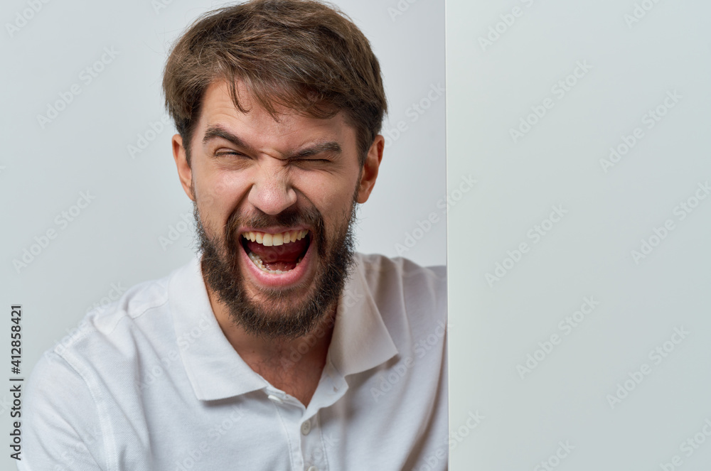 Fototapeta premium bearded man emotions white mockup advertisement presentation studio