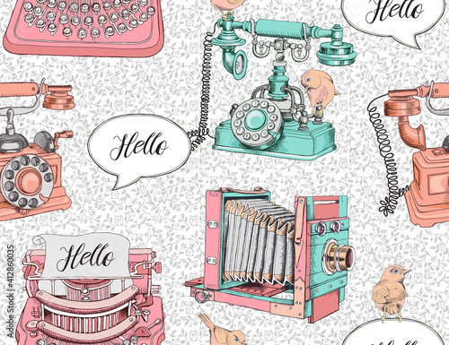 Seamless pattern with image of a vintage Telephone, Camera, Typewriter and birds on a decorative floral background. Vector illustration.