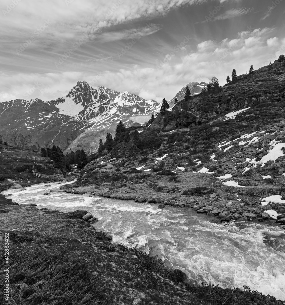 Grayscale. Summer Alps mountain stream on way to Kaunertal Glets