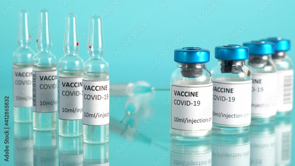Coronavirus vaccine background. Covid-19 vaccination with vaccine bottle and ampoules. Syringes for injection. Corona immunization treatment. Stop COVID. Zoom out. Coronavirus vaccine background. Covid-19 vaccination with vaccine bottle and ampoules. Syringes for injection. Corona immunization treatment. Stop COVID. Zoom out.