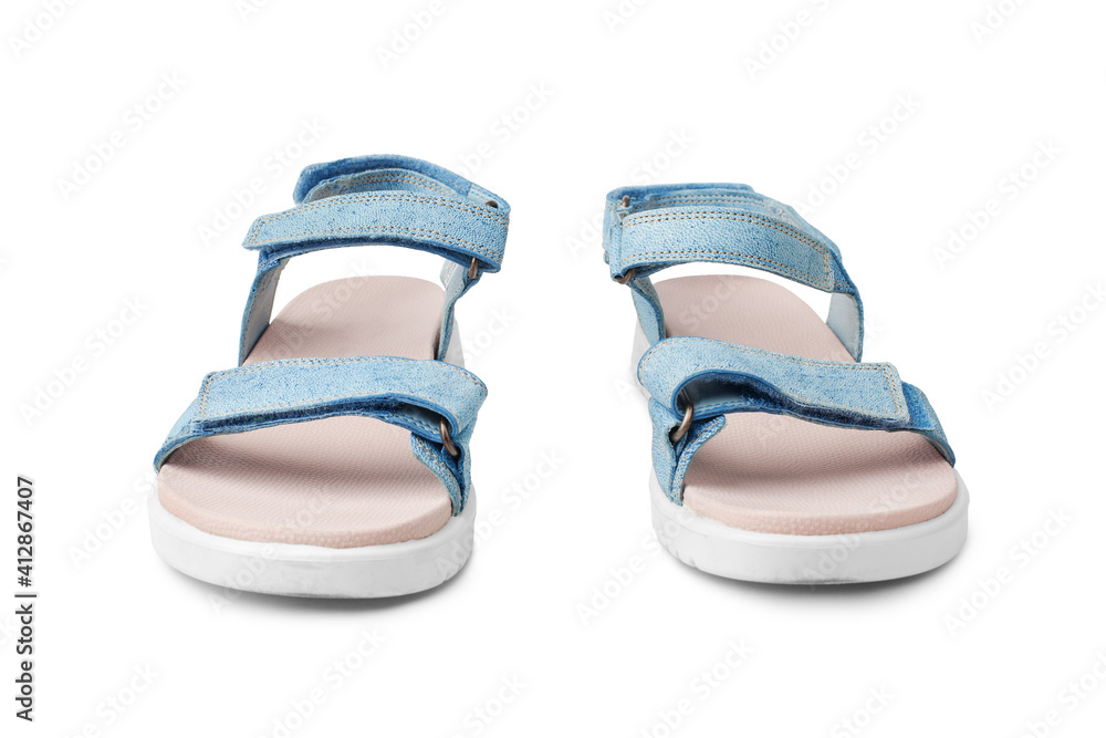 Blue female leather sandals, velcro straps, flat sole white background  isolated close up front view, women sandal shoes, pair of fashion summer  sandals, two comfortable boots, casual walking footwear Stock Photo