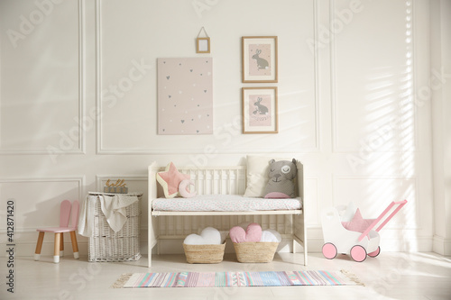 Baby room interior with stylish furniture and toys © New Africa