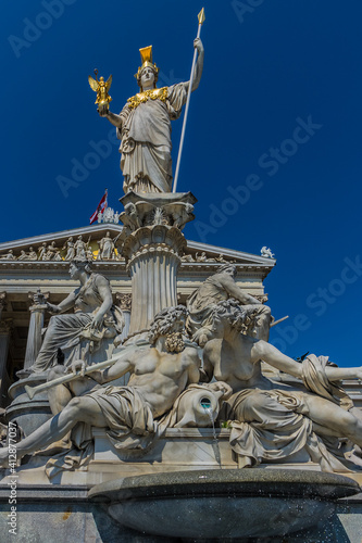 Pallas Athena fountain with 5 m tall statue of the Goddess of Wisdom (Pallas-Athene-Brunnen, 1898), in front of Austrian Parliament. Vienna, Austria, Europe.