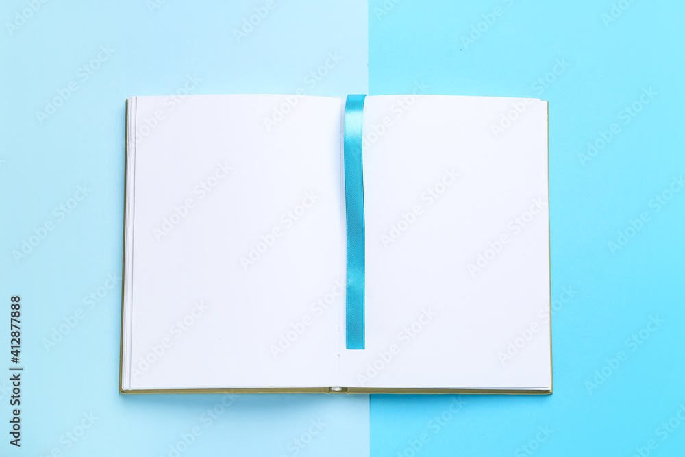 Blank book with bookmark on color background Blank book with bookmark on color background