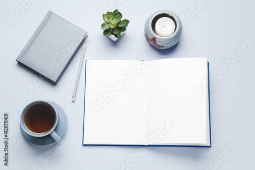Blank book, cup of tea and ...