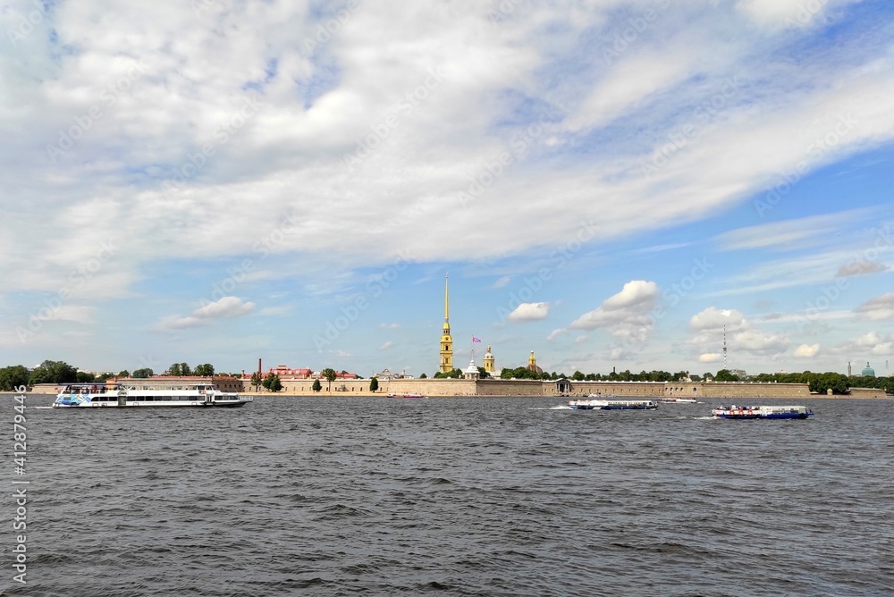 Panorama of Neva river and Peter-Paul fortress with boats in a sunny summer day
