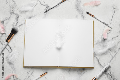 Blank open book and makeup ...