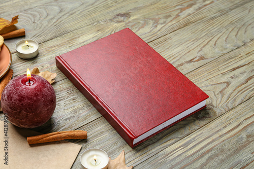 Red book with candles and a...