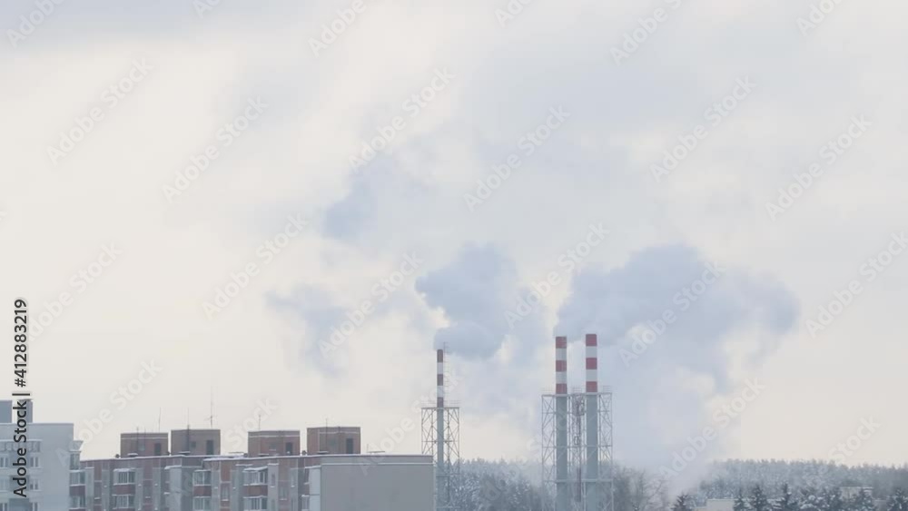 Smoke comes from the chimney on a winter day. Smoke comes from the chimney on a winter day.