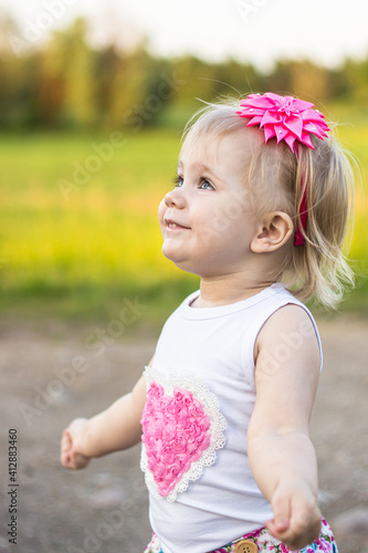 little girl dancing on a country road