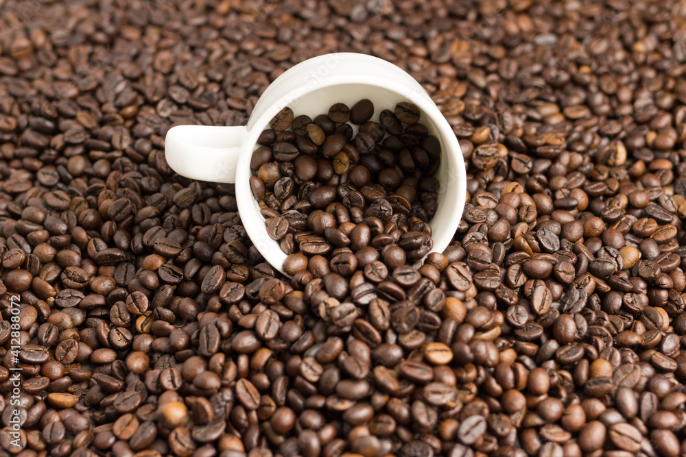 Aromatic coffee beans in a mug. Aromatic coffee beans in a mug.