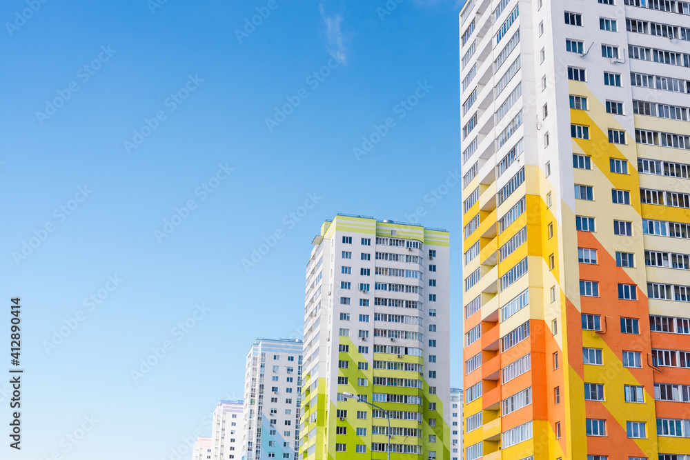 windows on colorful building, new building, residential area 