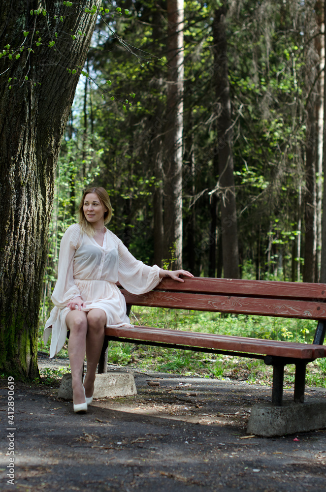 young girl in a dress in the park young girl in a dress in the park