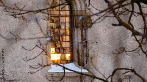 Golden church window with snow