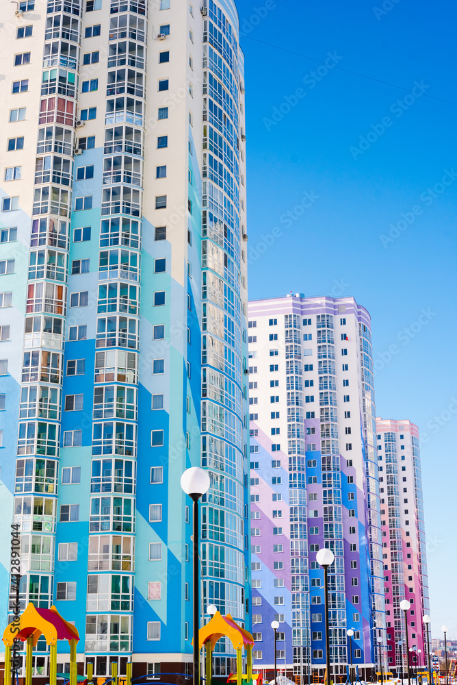 windows on colorful building, new building, residential area 
