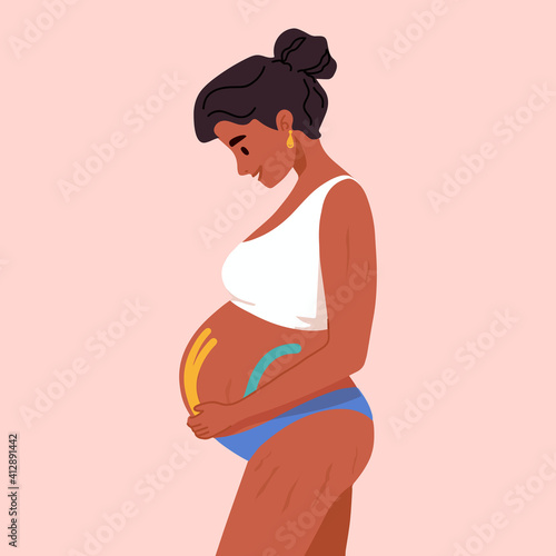 Beautiful smiling pregnant african american women in underwear or swimsuit. Pregnancy belly with kinesio taping, Kinesiology . Motherhood. New born. Young dark skinned mother.