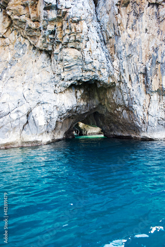Picturesque caves in the cliffs along the coast that allow the passage by swimming or by small boats or kayaks. Palinuro. Italy. 
