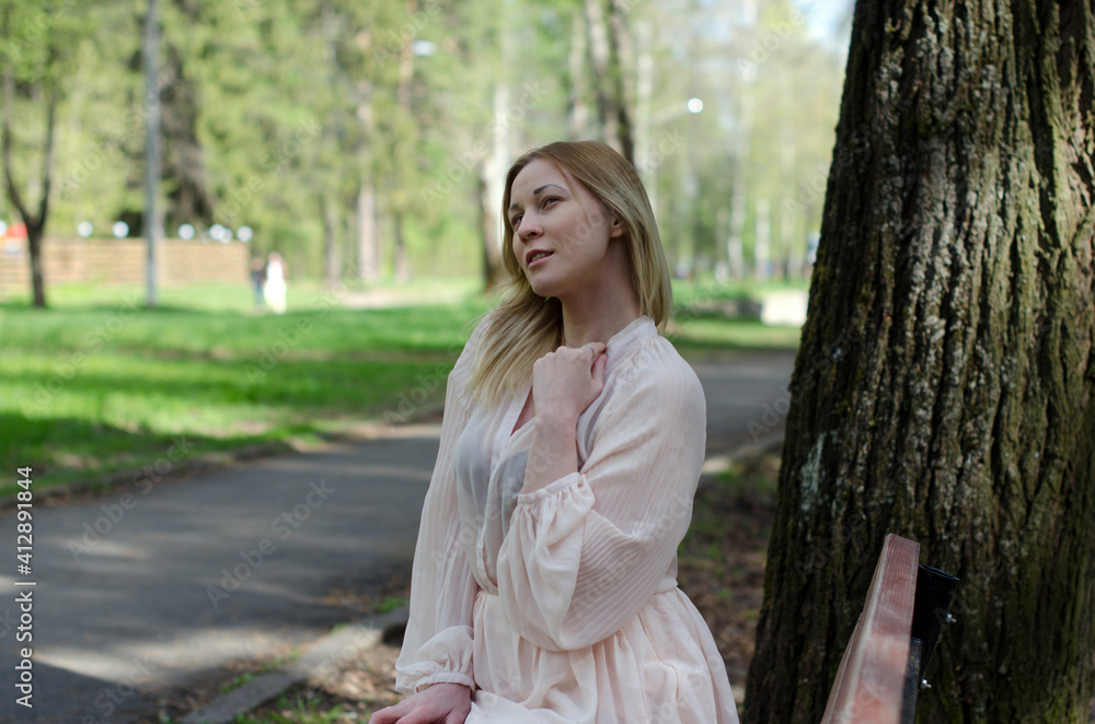 young girl in a dress in the park young girl in a dress in the park