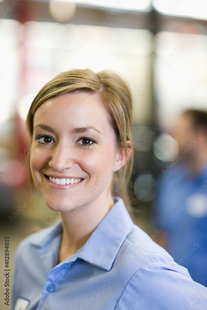 Portrait of young female Caucasian mechanic in auto repair shop Portrait of young female Caucasian mechanic in auto repair shop
