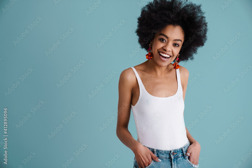 Happy african american girl smiling and looking at camera Happy african american girl smiling and looking at camera