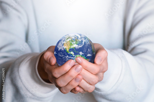 Human holds Earth planet globe. Our home. Green planet. Environmental protection concept. 