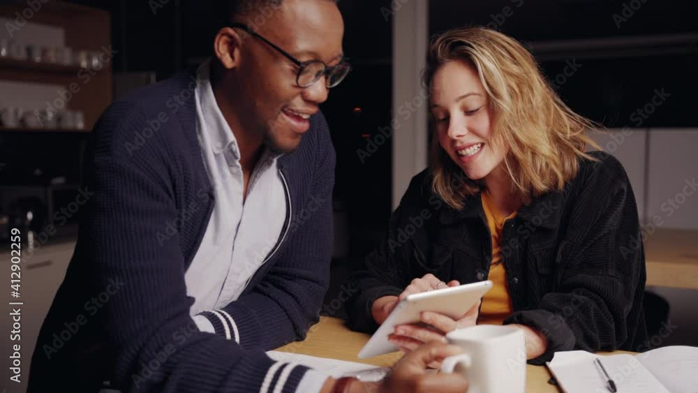Caucasian business woman brainstorming ideas with mixed race male colleague for collaboration project 