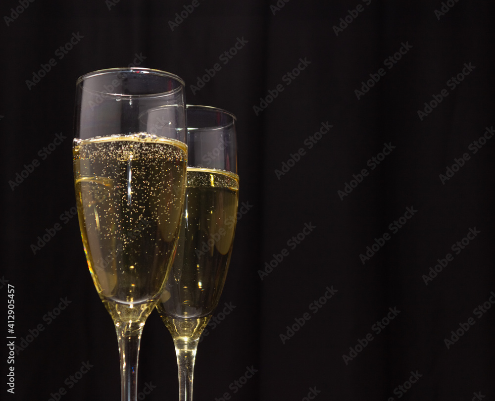 Champagne glasses on a dark background. The concept of the celebration. Champagne glasses on a dark background. The concept of the celebration.