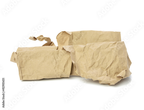piece of crumpled brown paper isolated on white background, element for designer