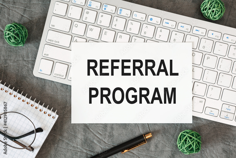 Fototapeta premium Referral program is written in a document on the office desk
