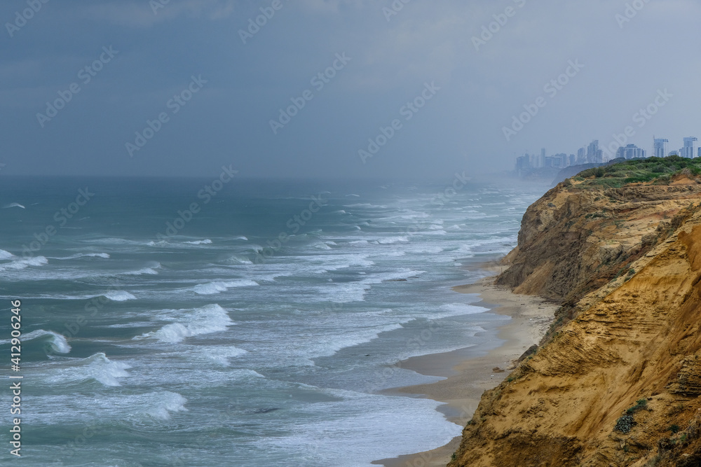 Fototapeta premium Arsuf cliff, a kurkar sandstone cliff reserve towering high above the Mediterranean sea coastline between Herzliya and Netanya towns, Israel.