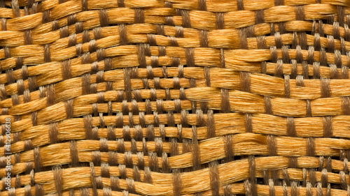 Close-up background of bright golden textile texture