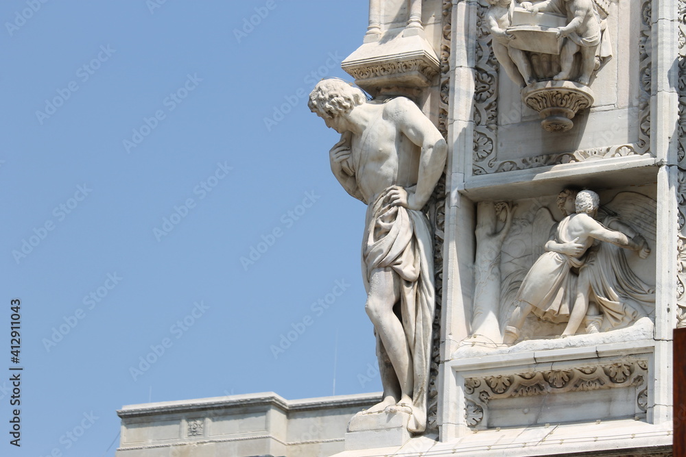 Detail of a sculpture on the facade of the Milan Cathedral, Italy Detail of a sculpture on the facade of the Milan Cathedral, Italy