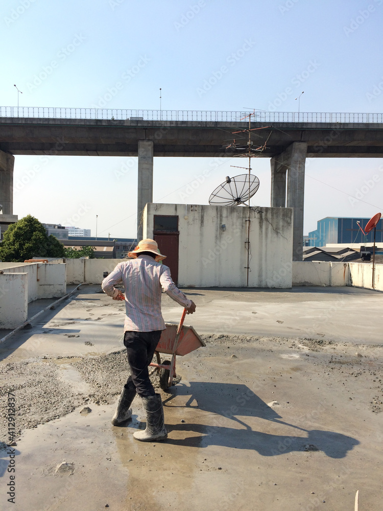 worker poured concrete floors. worker poured concrete floors.