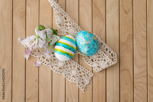 Easter concept. Easter decoration with colorful painted easter eggs on a wooden background