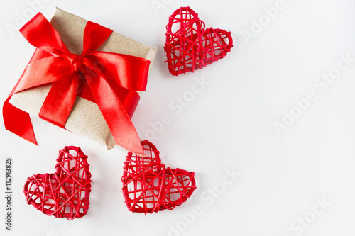 Valentine's day gift and red hearts on a white background