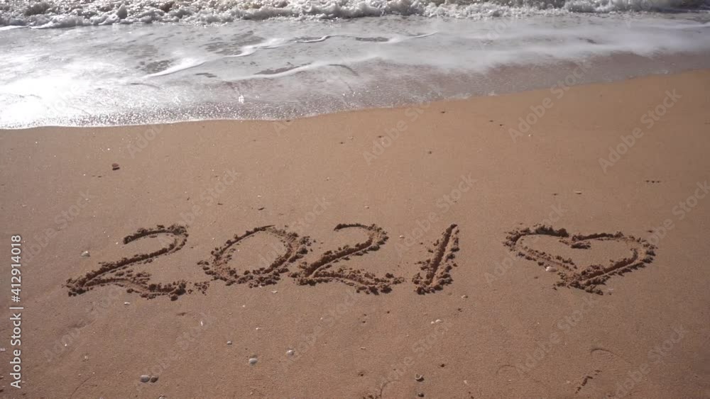 2021 year and love heart sign hand written sandy beach outdoors seascape background video clip 2021 year and love heart sign hand written sandy beach outdoors seascape background video clip