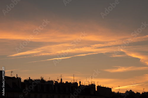 Parisian rooftops silhouettes at beautiful sunset. Paris  France. Urban sunset background.