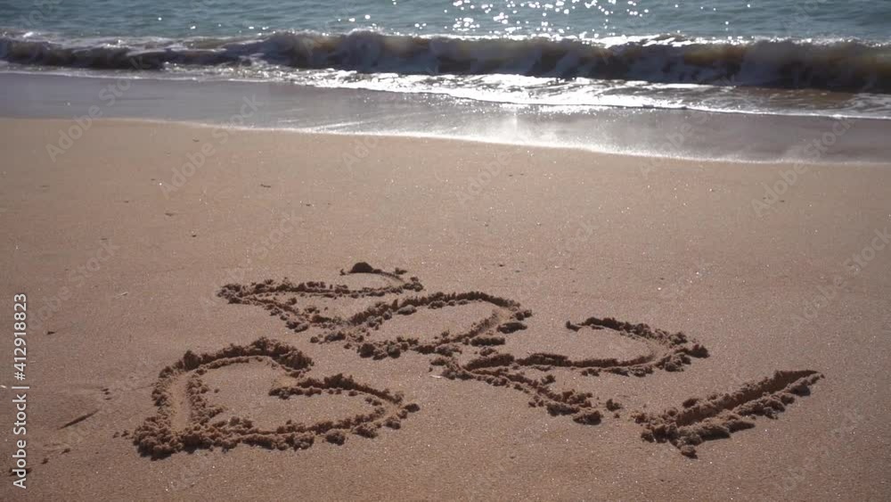 2021 year and romantic love heart sign hand written sandy beach outdoors seascape video clip 2021 year and romantic love heart sign hand written sandy beach outdoors seascape video clip