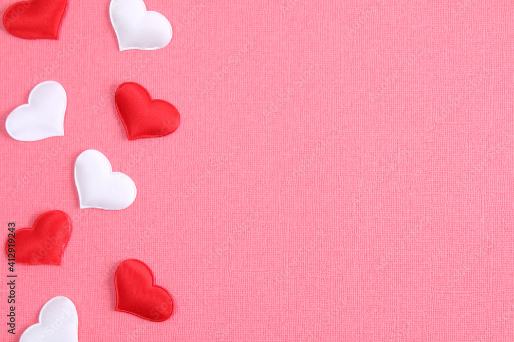 White heart and a red heart on a pink background. Concept for love day, Valentine's day, February 14th. Copy space. Valentine's Day card. White heart and a red heart on a pink background. Concept for love day, Valentine's day, February 14th. Copy space. Valentine's Day card.