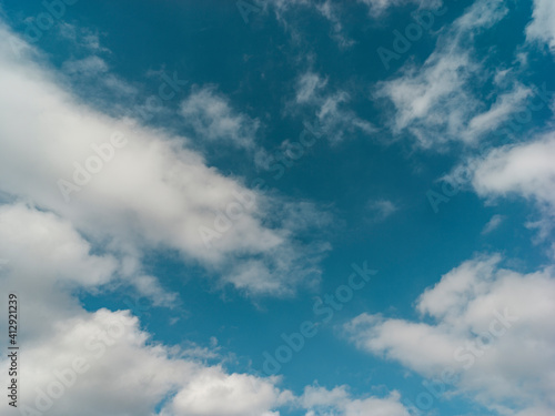 Texture of a blue sky with white clouds 