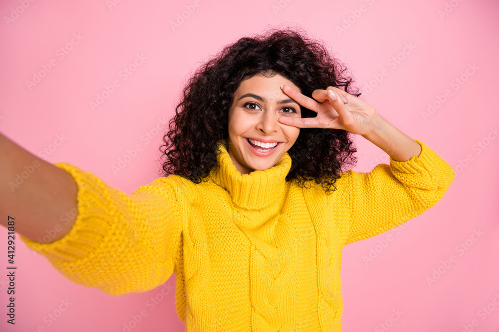 Photo of young cheerful latin girl happy smile make selfie show cool v-sign isolated over pink color background Photo of young cheerful latin girl happy smile make selfie show cool v-sign isolated over pink color background