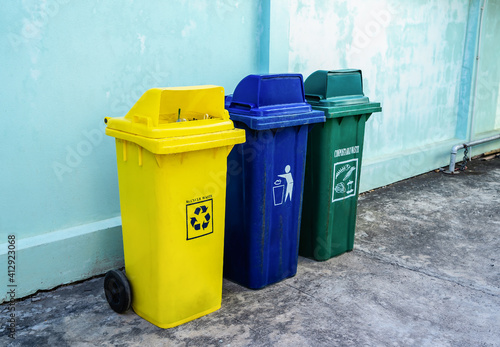 Three types of recycling bins for each type of waste. Conserve the environment. Separate buckets for plastic, paper, glass, Eco-friendly lifestyle to protect the environment. © maemodnit13