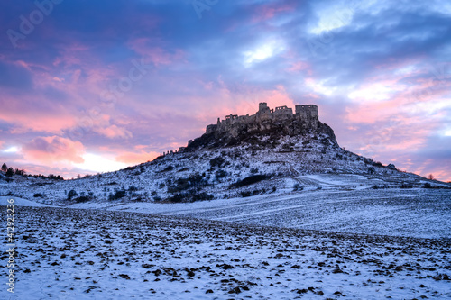 Old Spis Zipser Castle above valley at sunset
