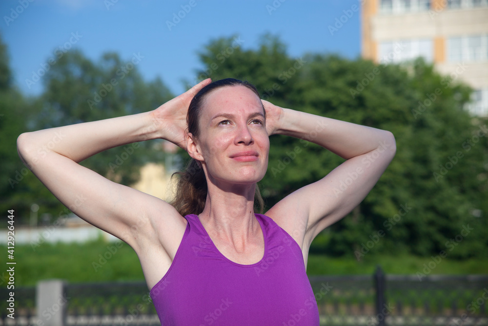girl athlete fitness exercise in the fresh
air in the summer. Fitness Good mood,
positive mood, happiness in motion. girl athlete fitness exercise in the fresh
air in the summer. Fitness Good mood,
positive mood, happiness in motion.
