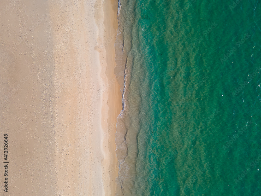 (Top view) Aerial view drone over beach sea. Beautiful sea waves. Beach sand and amazing sea. Summer sunset seascape. Phuket Thailand Beach. Water texture. Top view of the fantastic natural sunsets (Top view) Aerial view drone over beach sea. Beautiful sea waves. Beach sand and amazing sea. Summer sunset seascape. Phuket Thailand Beach. Water texture. Top view of the fantastic natural sunsets