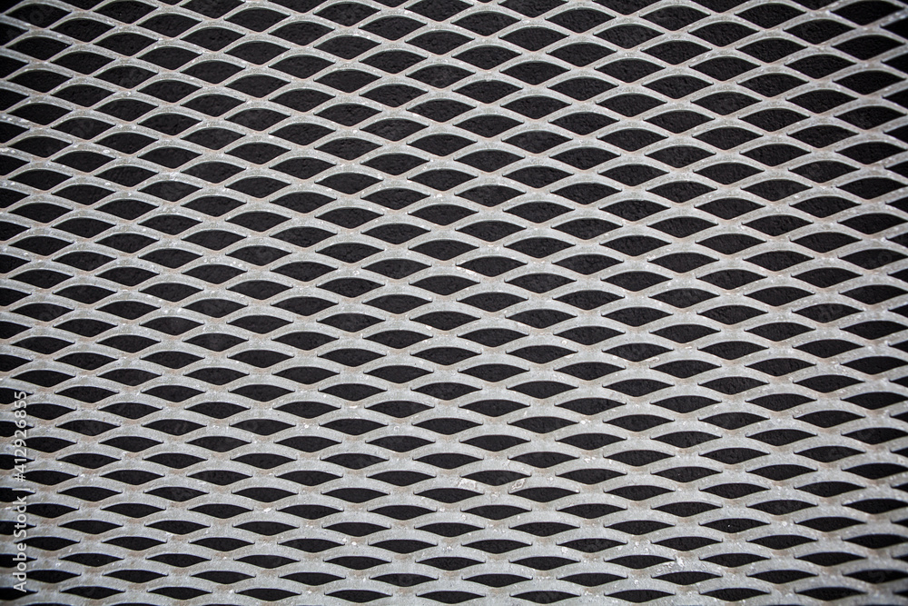 Texture from a fragment of a steel perforated panel Texture from a fragment of a steel perforated panel